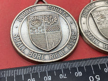 Load image into Gallery viewer, A Pair of Surrey County Small Bore Rifle Association Team Medallions.
