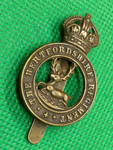 Load image into Gallery viewer, Original British Army WW1 / WW2 The Hertfordshire Regiment Cap Badge - The Militaria Shop
