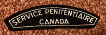 Load image into Gallery viewer, A vintage CANADA SERVICE PENITENTIAIRE cloth shoulder title.                B4
