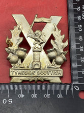 Load image into Gallery viewer, WW1 / WW2 British Army Tyneside Scottish  - White Metal Cap Badge.
