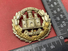 Load image into Gallery viewer, WW1 / WW2 British Army Northamptonshire Regiment Brass / White Metal Cap Badge.
