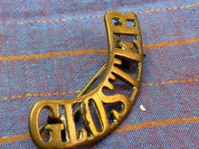 Load image into Gallery viewer, Original WW1 British Army Brass Gloster Regiment Shoulder Title
