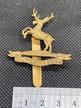 Load image into Gallery viewer, Original British Army WW1 HUNTINGDONSHIRE REGIMENT Cap Badge
