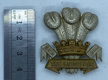 Load image into Gallery viewer, THE LEINSTER Regiment cap badge in brass &amp; white metal with rear slider - - B36
