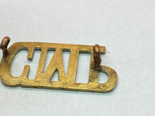 Load image into Gallery viewer, Original British Army WW1 Corps of Military Police Brass Shoulder Title
