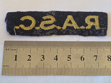 Load image into Gallery viewer, WW2 British Army RASC Royal Army Service Corps Paste-Back Shoulder Title.
