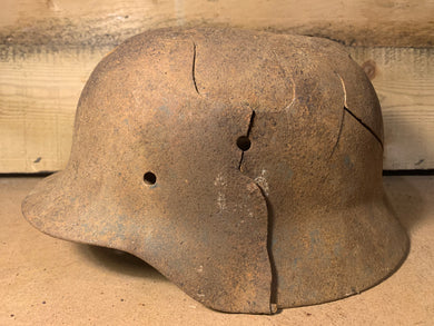 Blast damage german helmet 